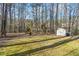 Backyard features a swing set, storage shed, and plenty of space for to play at 2285 Briarwood Trl, Cumming, GA 30041