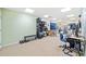 Finished basement with desk, drum set, and exercise equipment at 2285 Briarwood Trl, Cumming, GA 30041