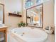 Bright bathroom with soaking tub and expansive vanity at 2285 Briarwood Trl, Cumming, GA 30041