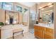 Bright bathroom with soaking tub, glass shower, and expansive double vanity at 2285 Briarwood Trl, Cumming, GA 30041