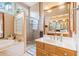 Bright bathroom with shower and expansive vanity with sink at 2285 Briarwood Trl, Cumming, GA 30041