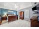 Spacious bedroom featuring neutral carpet, tray ceiling, and abundant natural light at 2285 Briarwood Trl, Cumming, GA 30041