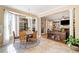 Inviting breakfast nook features a round table, bay window, and seamless transition into the adjacent living space at 2285 Briarwood Trl, Cumming, GA 30041