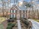 Beautiful two-story brick home featuring lush landscaping and a private driveway at 2285 Briarwood Trl, Cumming, GA 30041