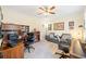 Comfortable home office with plenty of desk space, a ceiling fan and a comfortable couch at 2285 Briarwood Trl, Cumming, GA 30041