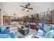 This screened porch offers comfortable seating, ceiling fans and a peaceful view of the trees at 2285 Briarwood Trl, Cumming, GA 30041