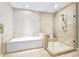 Elegant bathroom boasts soaking tub and large glass-enclosed shower at 270 17Th Nw St # 4208, Atlanta, GA 30363