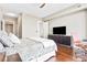 Comfortable bedroom featuring hardwood floors, stylish furniture, and neutral paint palette at 270 17Th Nw St # 4208, Atlanta, GA 30363