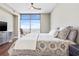 Bright bedroom offering a lovely view, hardwood floors, and neutral paint palette at 270 17Th Nw St # 4208, Atlanta, GA 30363