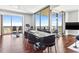 Dining area with floor-to-ceiling windows offering panoramic city views and a modern dining table at 270 17Th Nw St # 4208, Atlanta, GA 30363