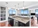 Kitchen island featuring granite countertops, a stainless steel sink and breathtaking city views at 270 17Th Nw St # 4208, Atlanta, GA 30363