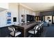 Open kitchen with a massive island, modern fixtures, seating, and high ceilings with light filled windows at 270 17Th Nw St # 4208, Atlanta, GA 30363