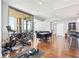 Spacious living area featuring exercise equipment, a dining area, and bar, with views from large windows at 270 17Th Nw St # 4208, Atlanta, GA 30363