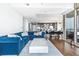 Open-concept living room with hardwood floors, a dining area, and a modern kitchen ideal for entertaining friends at 270 17Th Nw St # 4208, Atlanta, GA 30363