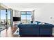 Living room with floor to ceiling windows and a comfortable seating arrangement for relaxing and watching television at 270 17Th Nw St # 4208, Atlanta, GA 30363