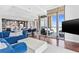 Spacious living area featuring modern décor with hardwood floors and expansive windows providing lots of natural light at 270 17Th Nw St # 4208, Atlanta, GA 30363