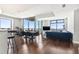 Living room featuring hardwood floors, floor to ceiling windows and access to a balcony with an amazing view at 270 17Th Nw St # 4208, Atlanta, GA 30363