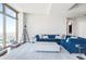 Living room featuring a large rug, stylish decor, plush seating and plenty of natural light from the large windows at 270 17Th Nw St # 4208, Atlanta, GA 30363