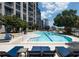 The condo complex outdoor pool offers clear blue water, a great view of the Atlanta skyline, and comfortable lounge chairs at 270 17Th Nw St # 4208, Atlanta, GA 30363