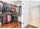 Open walk-in closet with built-in shelving and organization system; adjacent to bath at 270 17Th Nw St # 4208, Atlanta, GA 30363