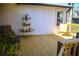 Wooden back deck offers space for outdoor entertaining with natural light and seating at 3065 Wildflower Ln, Snellville, GA 30039