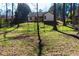 Spacious backyard with a wooden deck, and chain link fence bordering neighboring properties at 3065 Wildflower Ln, Snellville, GA 30039