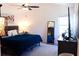 Cozy bedroom with a comfy bed, modern decor, and a window at 3065 Wildflower Ln, Snellville, GA 30039