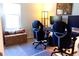 Bright home office space with dual monitor setup, ergonomic chairs, and ample natural light at 3065 Wildflower Ln, Snellville, GA 30039