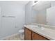 A well-lit bathroom features a wooden vanity, a granite countertop, and neutral walls at 695 Georgetown Ct, Jonesboro, GA 30236