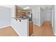 Functional kitchen with stainless steel appliances, wooden cabinets, and a breakfast bar at 695 Georgetown Ct, Jonesboro, GA 30236