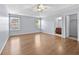 Spacious main bedroom with hardwood floors, a ceiling fan, and natural light at 695 Georgetown Ct, Jonesboro, GA 30236