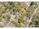 Bird's eye view of the property in a residential area surrounded by mature trees at 2073 Lou Ct, Grayson, GA 30017