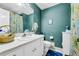 Bright bathroom with floral wallpaper, a large mirror, vanity, and modern fixtures at 2073 Lou Ct, Grayson, GA 30017