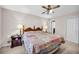 A homey bedroom with neutral paint, carpet, window, ceiling fan, and traditional furniture at 2073 Lou Ct, Grayson, GA 30017