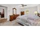 Comfortable bedroom with a plush bed, natural light from the window, and a classic wood dresser at 2073 Lou Ct, Grayson, GA 30017