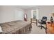 Bedroom with large closet, neutral paint, carpet, natural light, and a comfortable office space at 2073 Lou Ct, Grayson, GA 30017