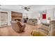 Cozy living room with hardwood floors, a brick fireplace, and comfortable seating, perfect for relaxation at 2073 Lou Ct, Grayson, GA 30017