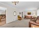Bright living room with neutral color scheme, plush carpeting, and furnishings that create a welcoming atmosphere at 2073 Lou Ct, Grayson, GA 30017