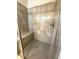 Walk-in shower featuring tiled walls, a seat, and glass door at 310 Ellington Dr, Canton, GA 30115