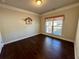 Bedroom with hardwood floors, natural light, and neutral paint at 310 Ellington Dr, Canton, GA 30115