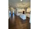Open-concept kitchen featuring a large island, white cabinets, and stainless steel appliances at 310 Ellington Dr, Canton, GA 30115