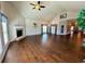 Large living room boasts a fireplace, vaulted ceiling, hardwood floors, and natural light at 310 Ellington Dr, Canton, GA 30115