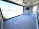 Covered patio with ceiling fan and mounted tv, outdoor space for entertaining at 310 Ellington Dr, Canton, GA 30115