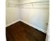 Walk-in closet features hardwood floors and shelves at 310 Ellington Dr, Canton, GA 30115