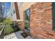 Close up view of the brick exterior featuring a sliding glass door and balcony access at 3334 Spring Meadow Ct, Tucker, GA 30084