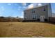 Expansive backyard with a privacy fence, offering ample space and a view of the home's rear exterior at 443 Faulkner St, Stockbridge, GA 30281