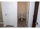 Bathroom featuring a toilet, shower, and vinyl flooring at 443 Faulkner St, Stockbridge, GA 30281