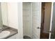 A bathroom vanity adjacent to a linen closet at 443 Faulkner St, Stockbridge, GA 30281