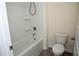 Modern bathroom with a clean white tub and shower combination and a contemporary toilet at 443 Faulkner St, Stockbridge, GA 30281