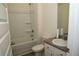 Bathroom with tub-shower combo, toilet and vanity with grey countertop and white cabinets at 443 Faulkner St, Stockbridge, GA 30281